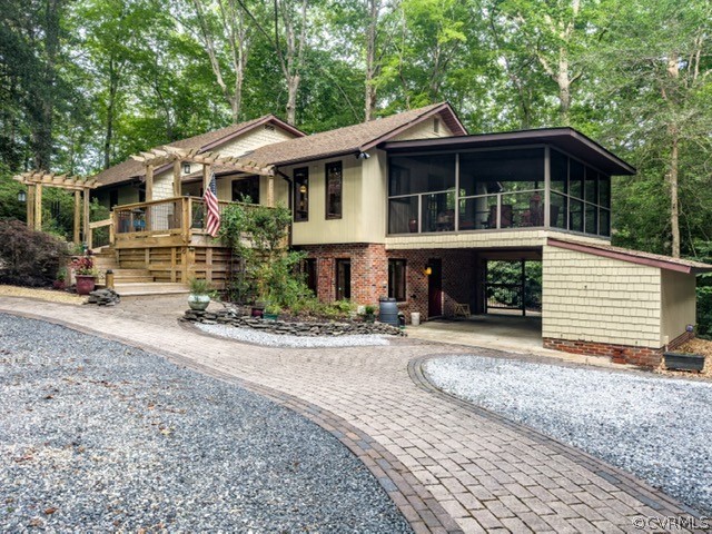125 Rte 1601 Williamsburg, VA 23188 - Photo 3 of 46 a front view of a house with a yard and garage