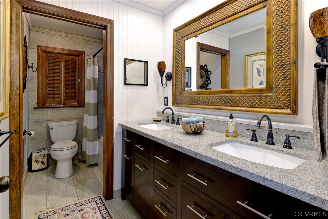 125 Rte 1601 Williamsburg, VA 23188 - Photo 31 of 46 a bathroom with a granite countertop sink two mirror and a toilet