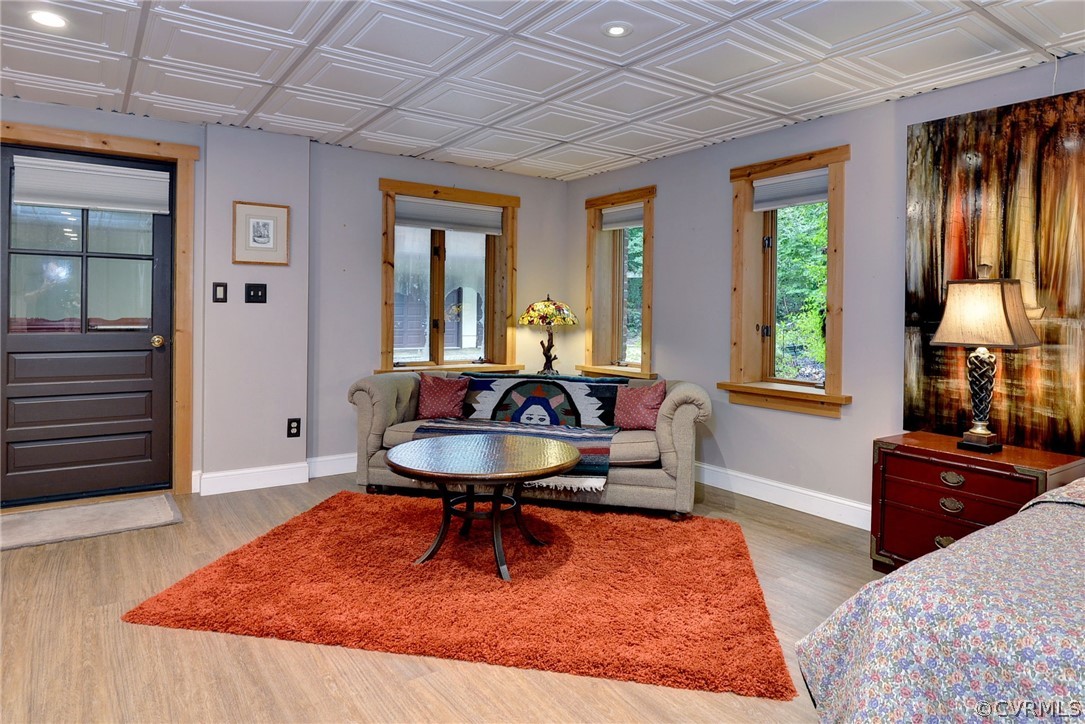 125 Rte 1601 Williamsburg, VA 23188 - Photo 37 of 46 a living room with furniture rug and wooden floor