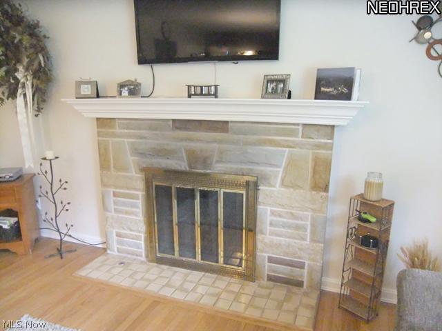 244 Winchester Road Akron, OH 44333 - Photo 5 of 21 .... and the focal point of the living room is the pretty stone fireplace with white mantle and gas starter.