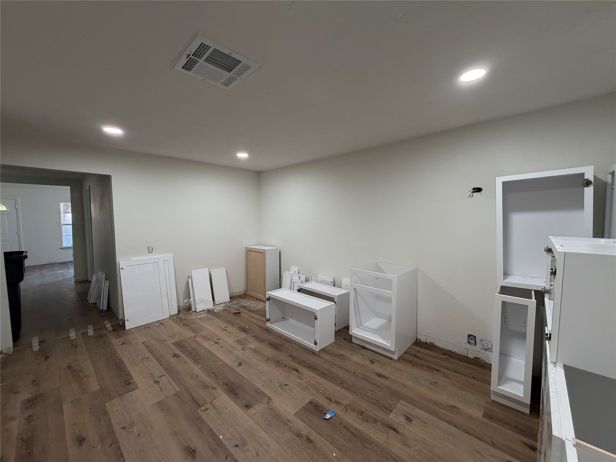 915 West Lewis Street Conroe, TX 77301 - Photo 4 of 6 a room with a bed and a view of chair