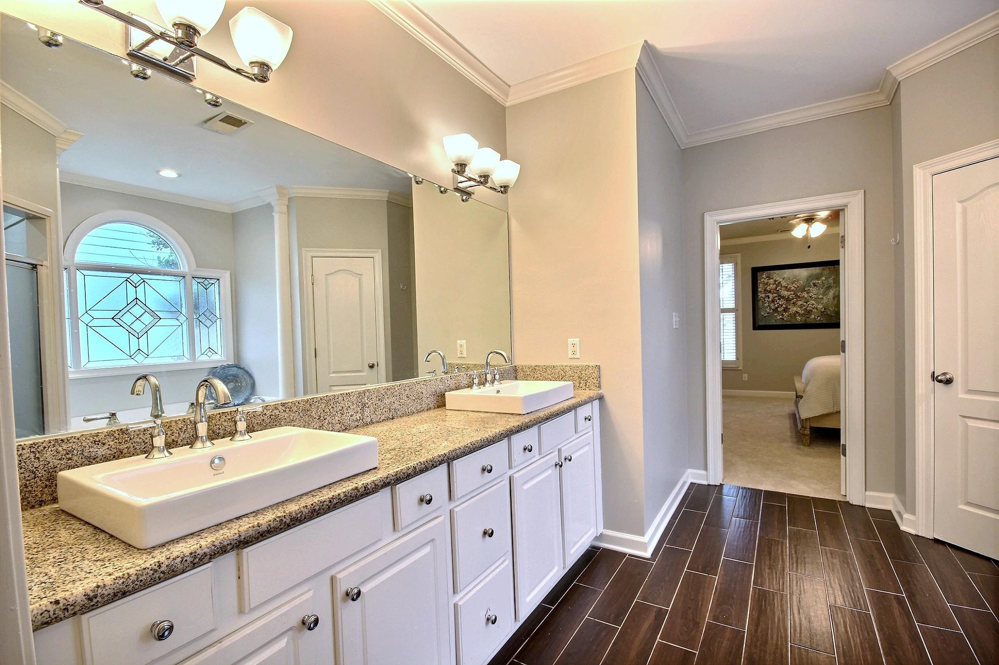 1050 Stanhope Road Collierville, TN 38017 - Photo 18 of 31 a spacious bathroom with a double vanity sink a mirror and a shower