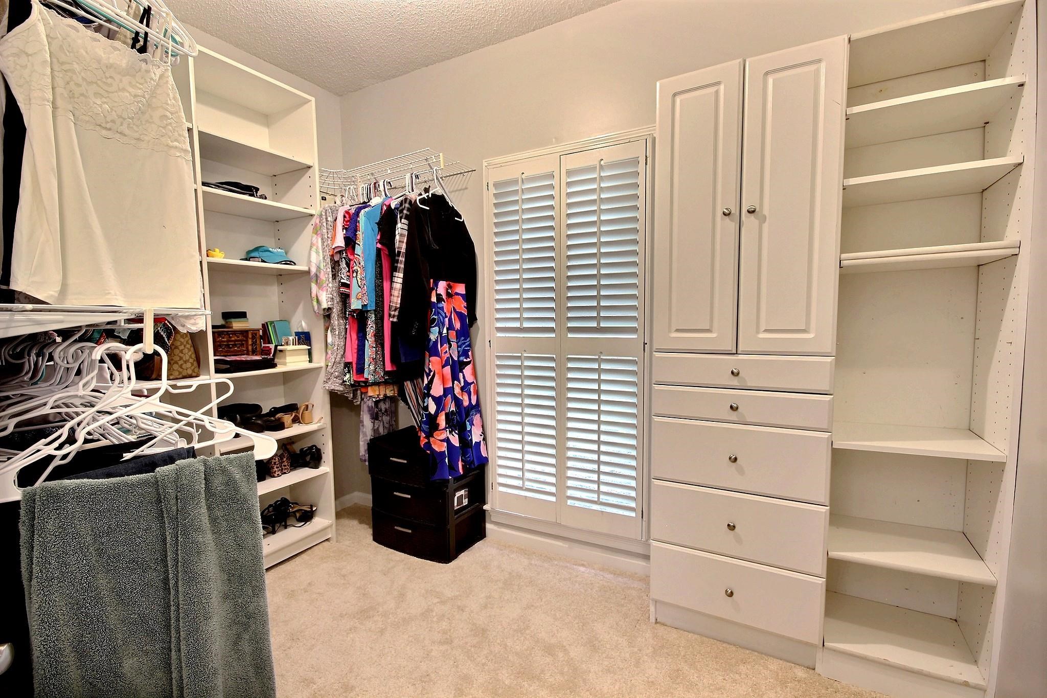 1050 Stanhope Road Collierville, TN 38017 - Photo 19 of 31 a view of walk in closet with clothes and shoes