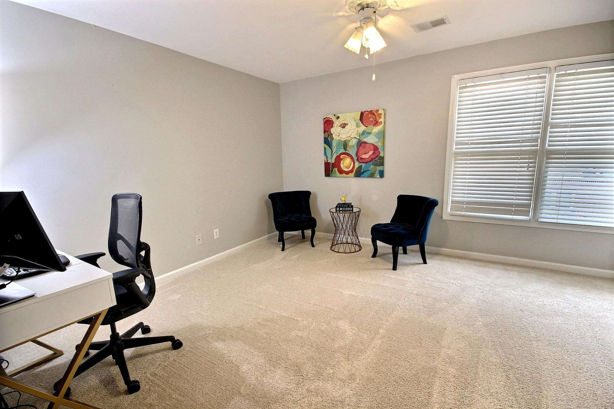 1050 Stanhope Road Collierville, TN 38017 - Photo 26 of 31 a view of a workspace with furniture and a window