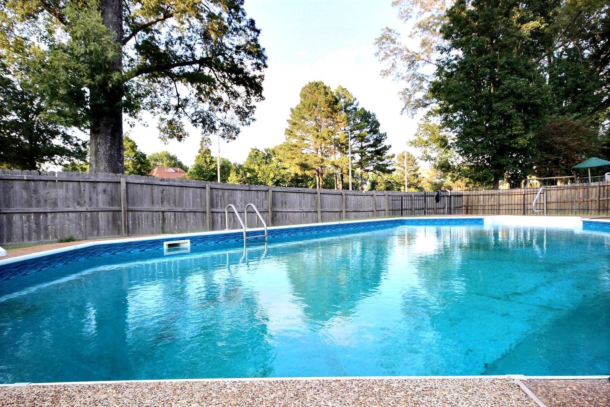 1050 Stanhope Road Collierville, TN 38017 - Photo 30 of 31 a view of swimming pool with outdoor space and trees in the background