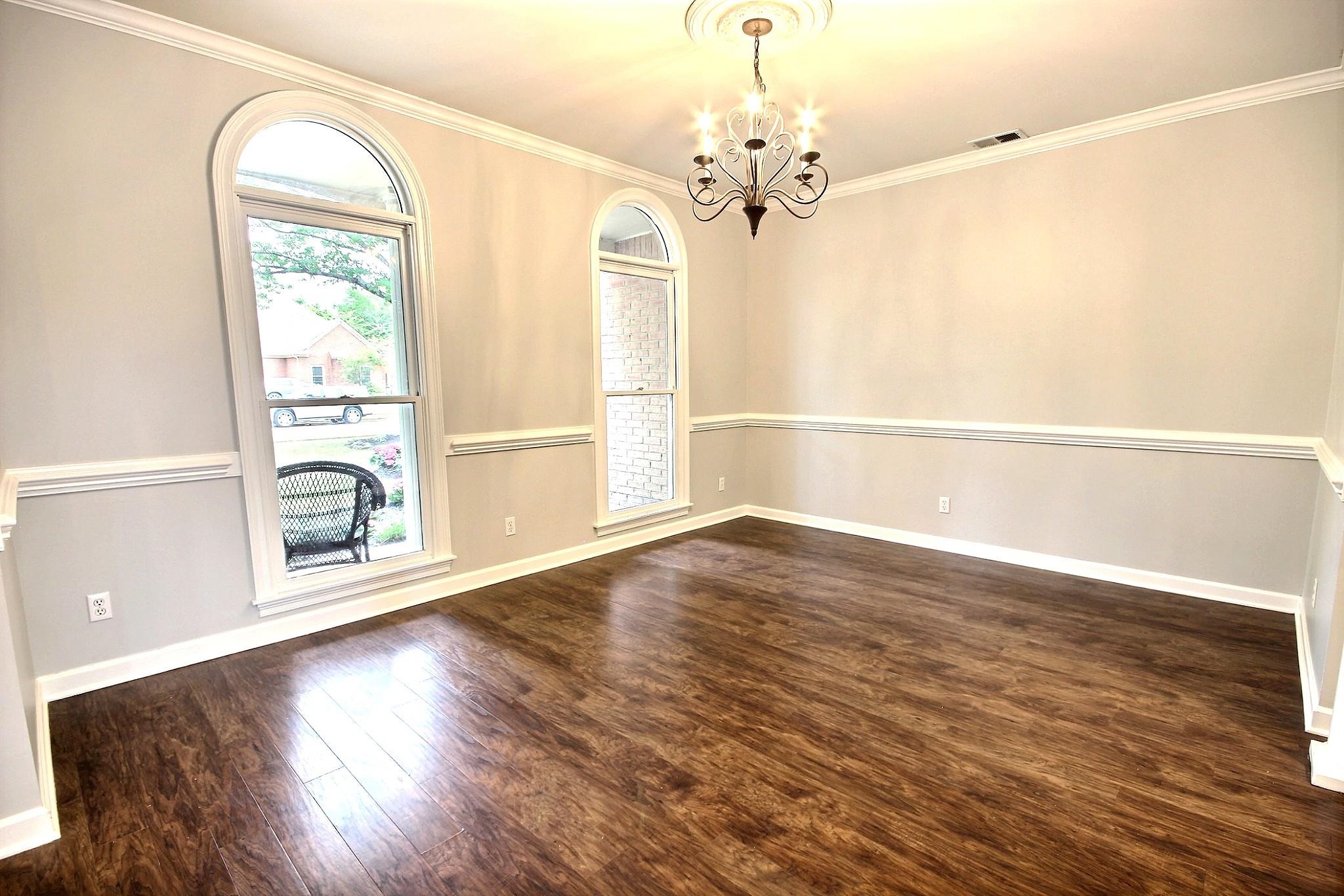 1050 Stanhope Road Collierville, TN 38017 - Photo 4 of 31 wooden floor in an empty room with a window