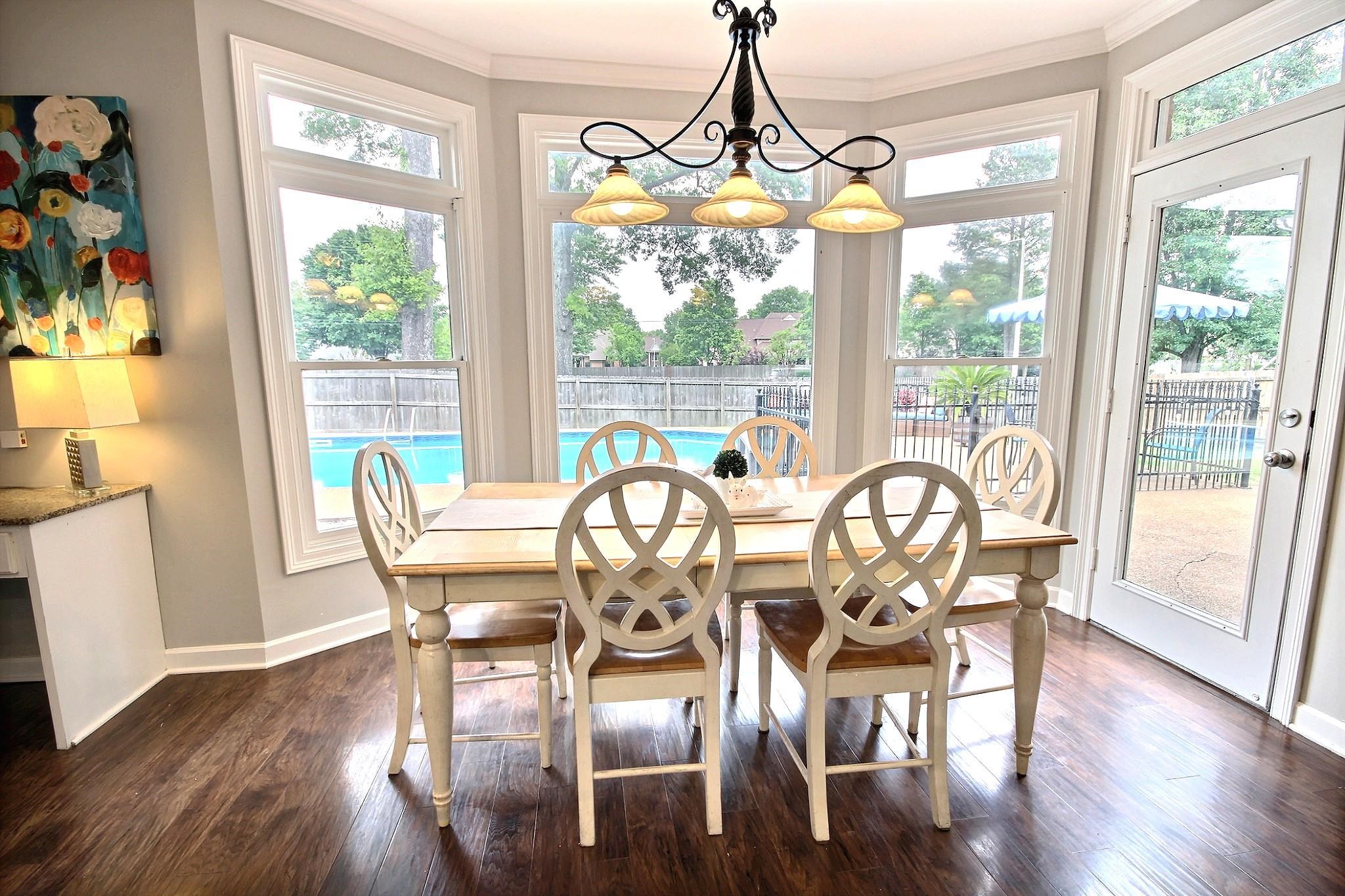 1050 Stanhope Road Collierville, TN 38017 - Photo 8 of 31 a view of a dining room with furniture window and wooden floor