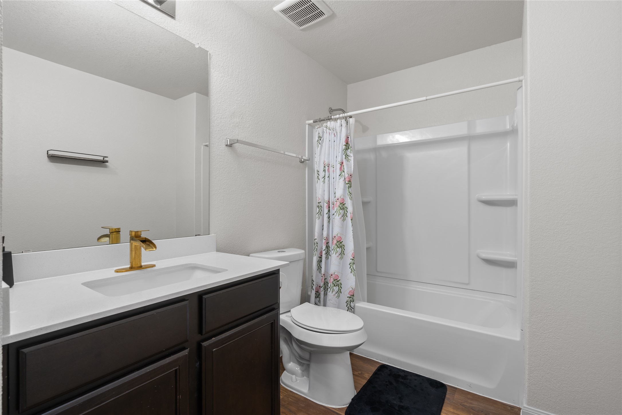 20205 Grover Cleveland Way Manor, TX 78653 - Photo 24 of 26 a bathroom with a sink a toilet and shower