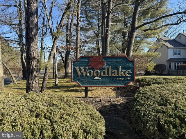 a view of a backyard with a table and chairs