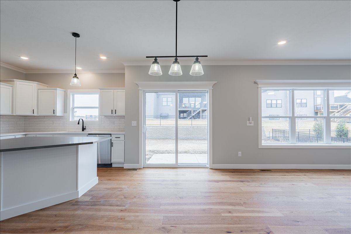 5206 Finlen Lane Bloomington, IL 61705 - Photo 11 of 40 a view of a kitchen with a sink and dishwasher wooden floor