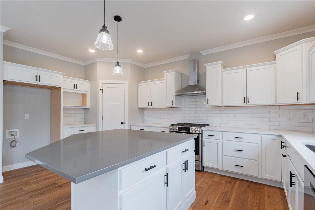 5206 Finlen Lane Bloomington, IL 61705 - Photo 12 of 40 a kitchen that has a lot of cabinets in it and wooden floors