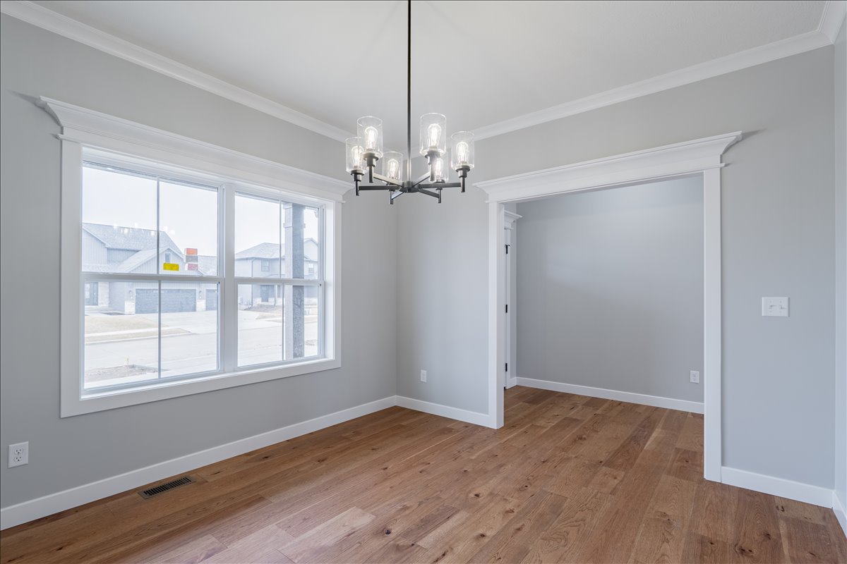 5206 Finlen Lane Bloomington, IL 61705 - Photo 3 of 40 a view of a room with wooden floor and windows