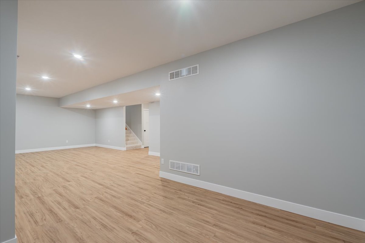 5206 Finlen Lane Bloomington, IL 61705 - Photo 31 of 40 a view of an empty room with wooden floor