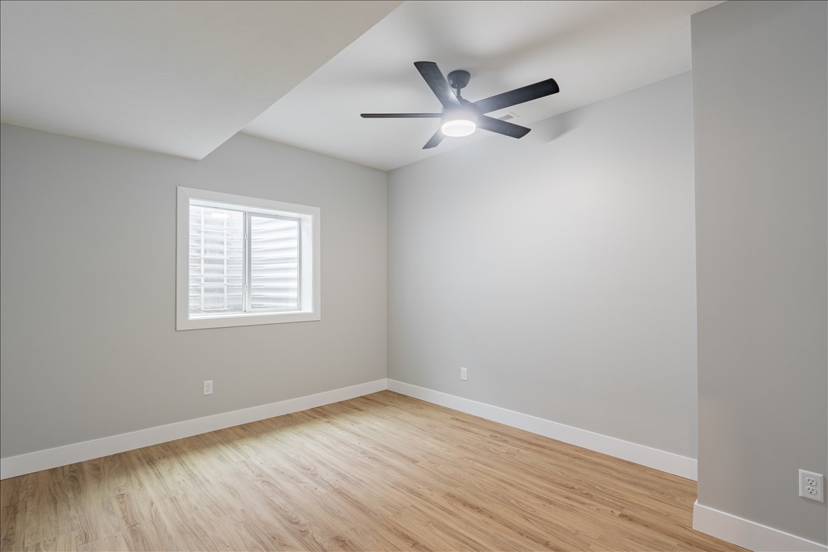 5206 Finlen Lane Bloomington, IL 61705 - Photo 34 of 40 an empty room with wooden floor closet and windows
