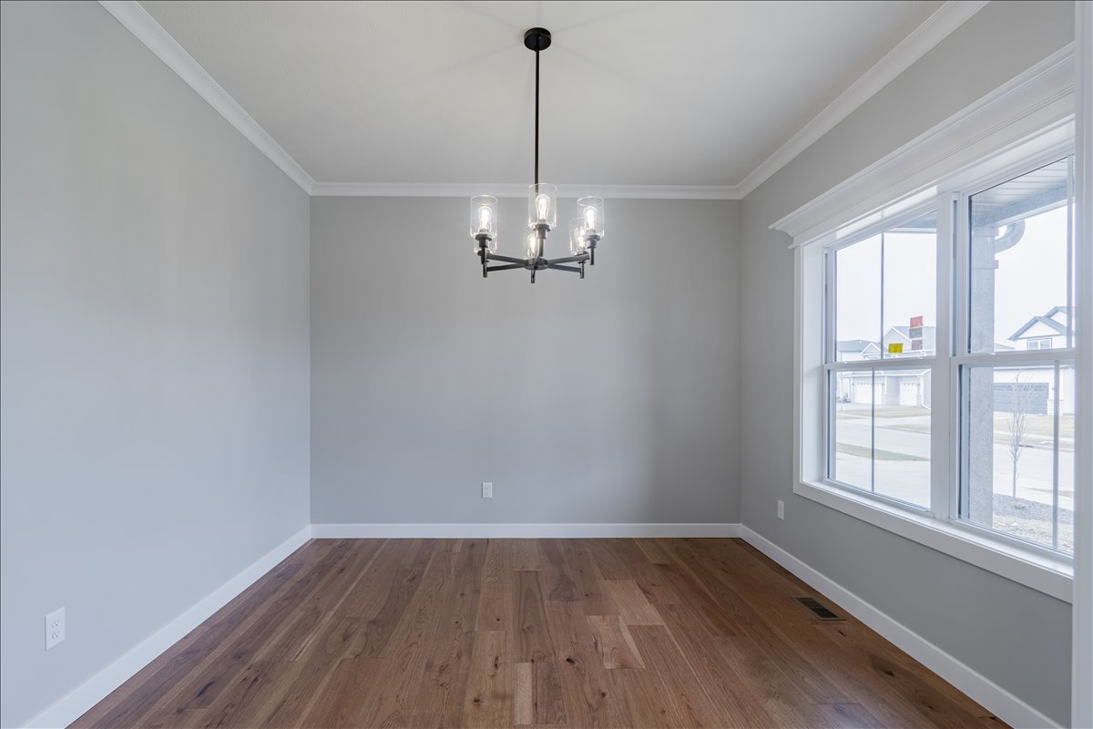 5206 Finlen Lane Bloomington, IL 61705 - Photo 5 of 40 wooden floor in an empty room with a window