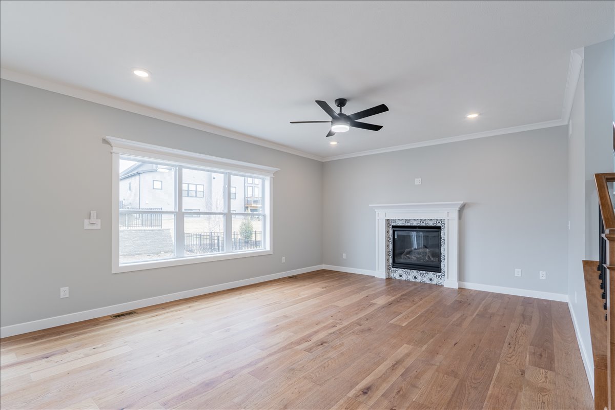 5206 Finlen Lane Bloomington, IL 61705 - Photo 7 of 40 a view of an empty room with a fireplace and a window