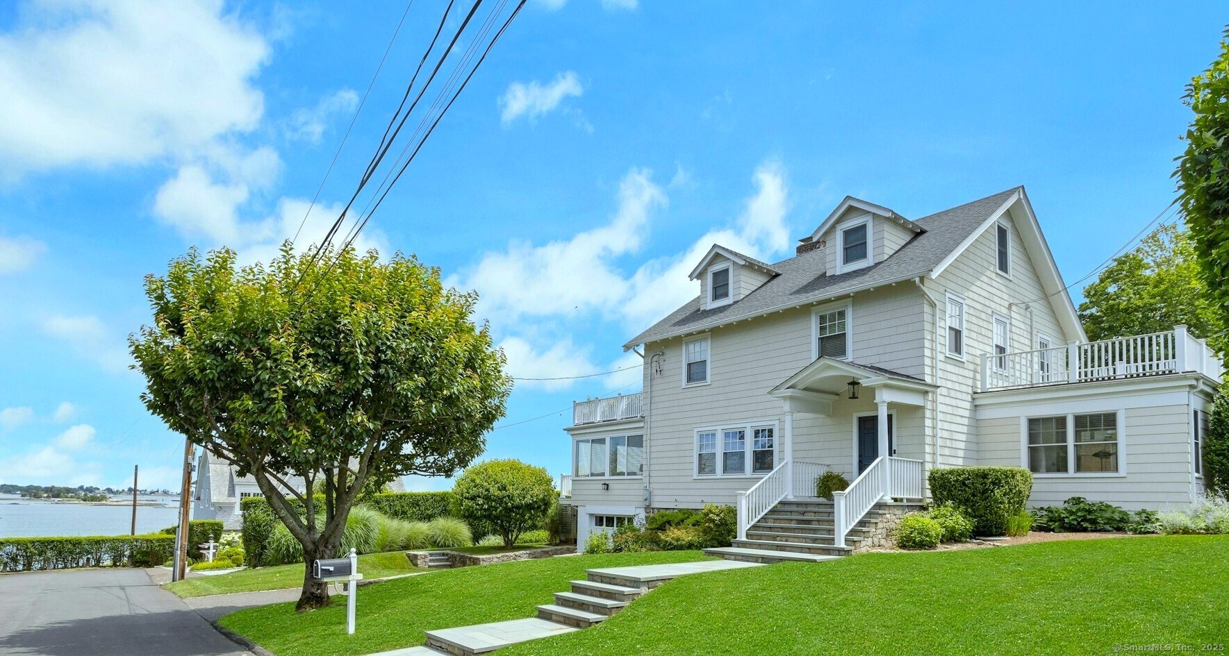 55 Gurley Road Stamford, CT 06902 - Photo 1 of 1 a front view of a house with a yard