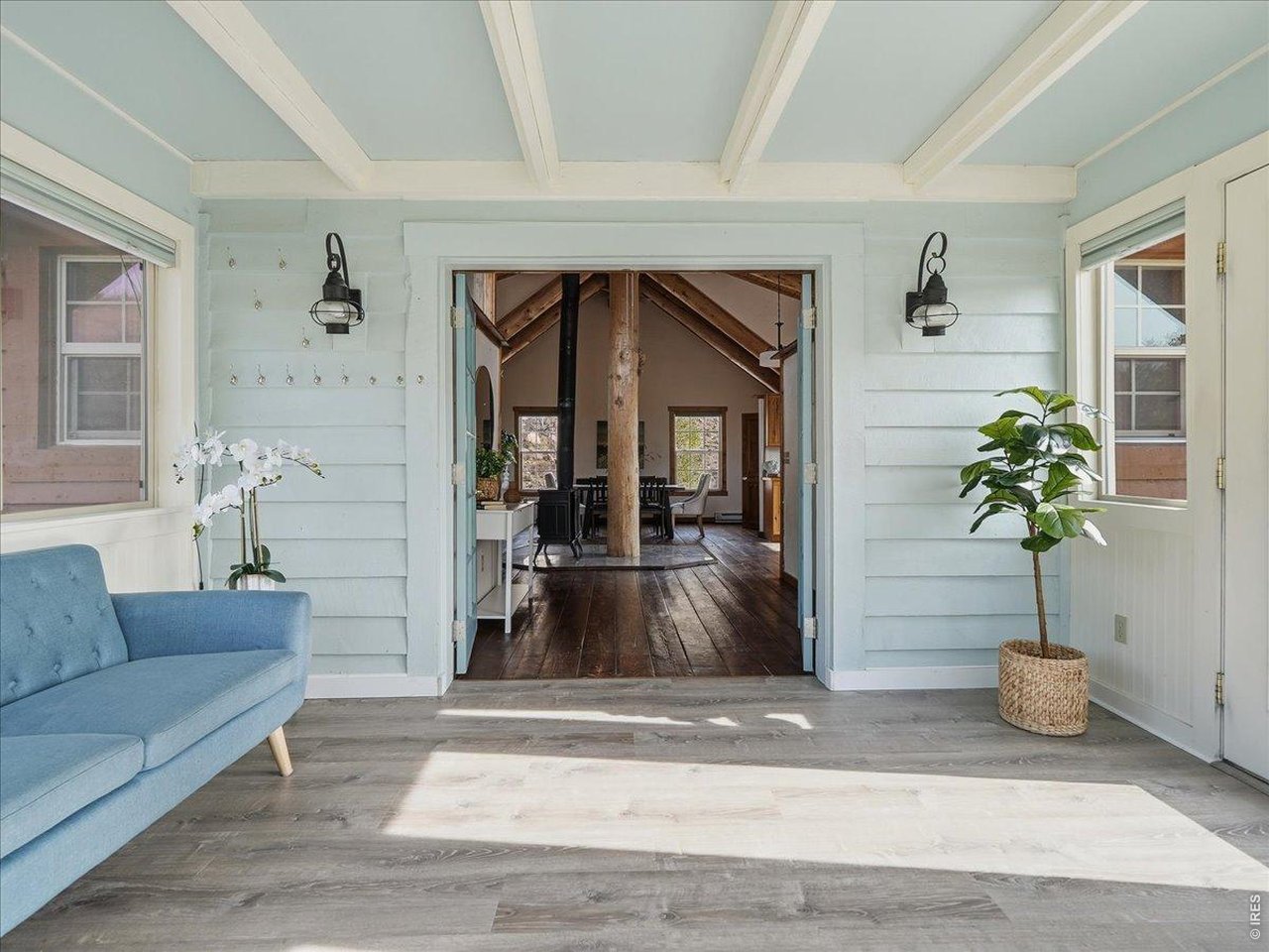 1652 Eiger Road Livermore, CO 80536 - Photo 16 of 50 Sunroom opens to main open living space.
