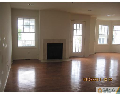 23 Raritan Reach Road South Amboy, NJ 08879 - Photo 3 of 14 a view of an empty room with wooden floor and a window