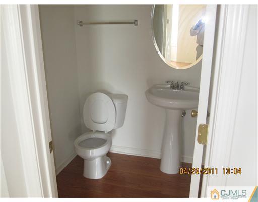 23 Raritan Reach Road South Amboy, NJ 08879 - Photo 6 of 14 a bathroom with a toilet and a sink