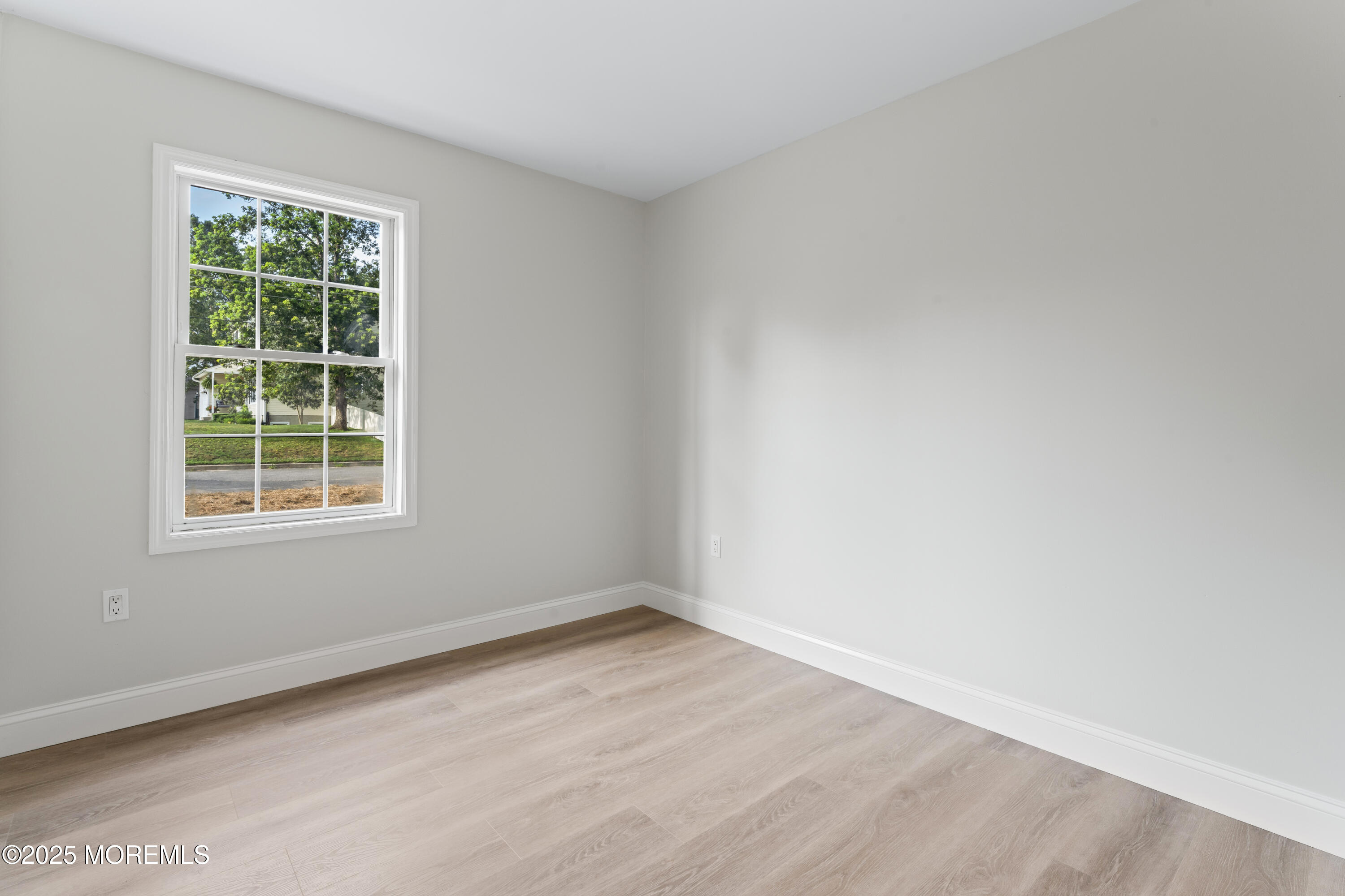 249 Crows Nest Road Manahawkin, NJ 08050 - Photo 11 of 21 an empty room with a window