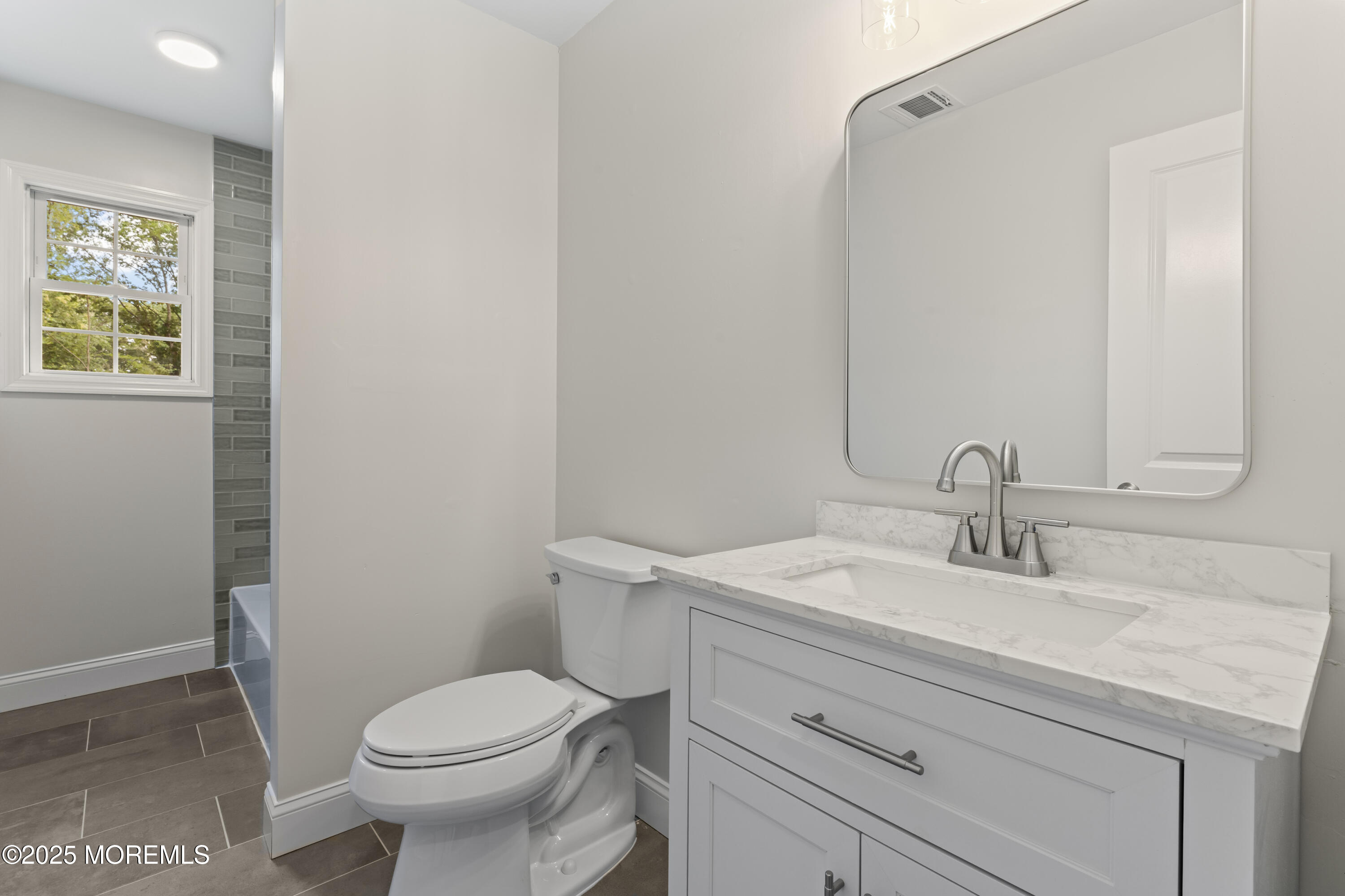 249 Crows Nest Road Manahawkin, NJ 08050 - Photo 13 of 21 a bathroom with a sink toilet and vanity