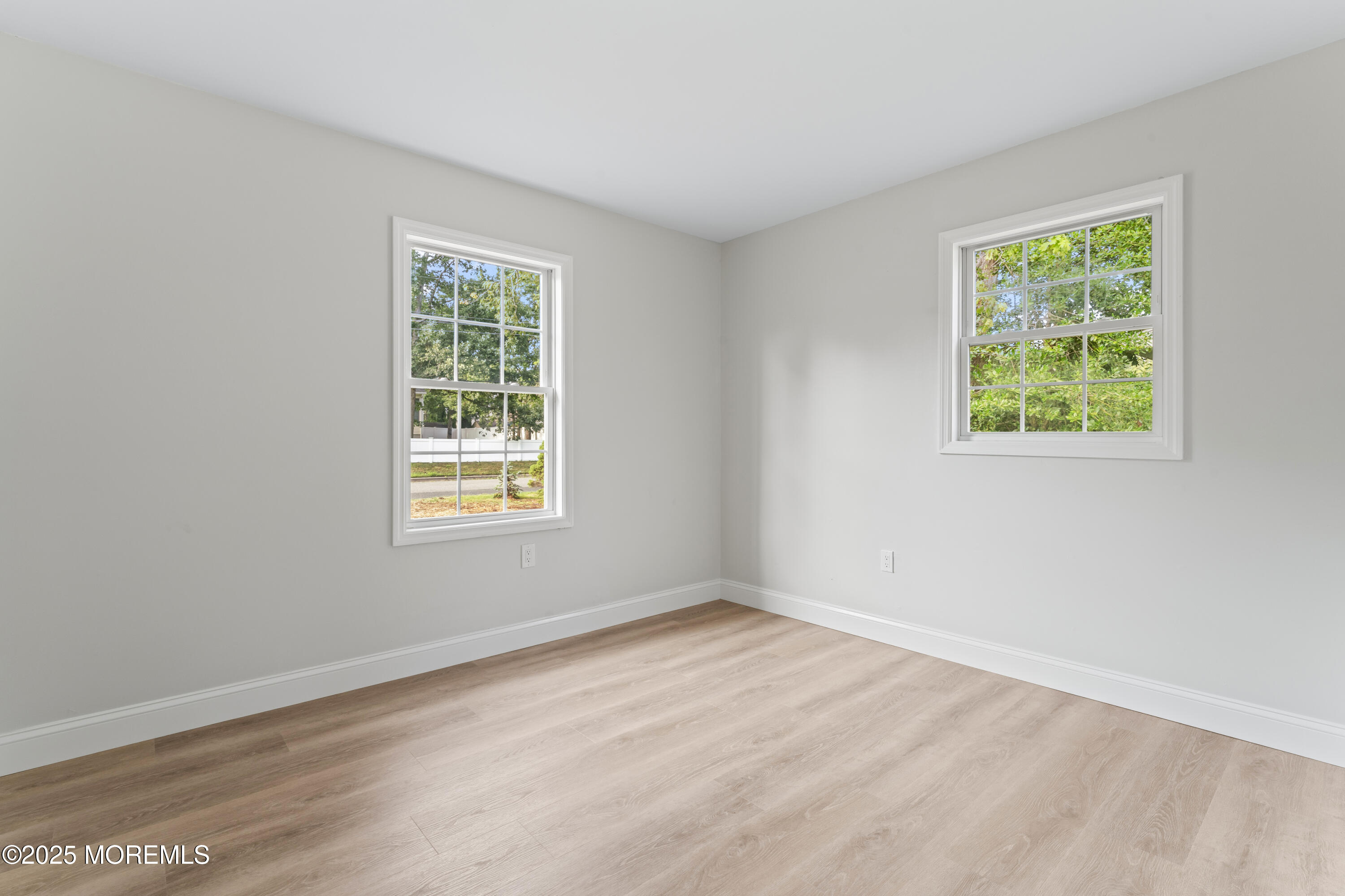 249 Crows Nest Road Manahawkin, NJ 08050 - Photo 15 of 21 a view of an empty room with wooden floor and a window