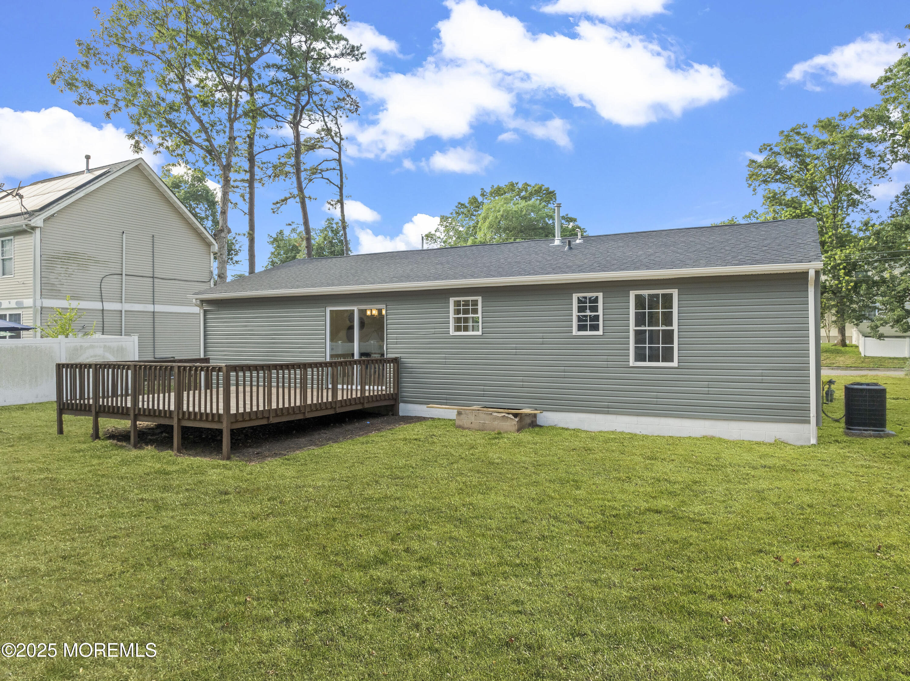 249 Crows Nest Road Manahawkin, NJ 08050 - Photo 19 of 21 a view of a house with a yard and sitting area