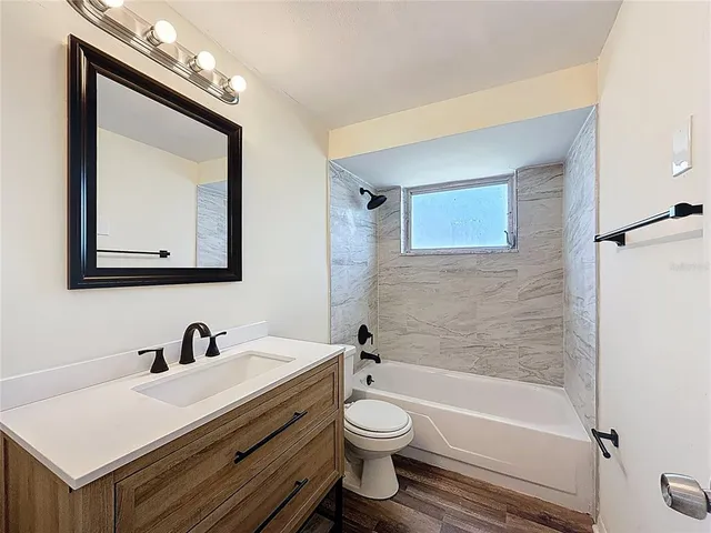a bathroom with a toilet a sink and a bathtub