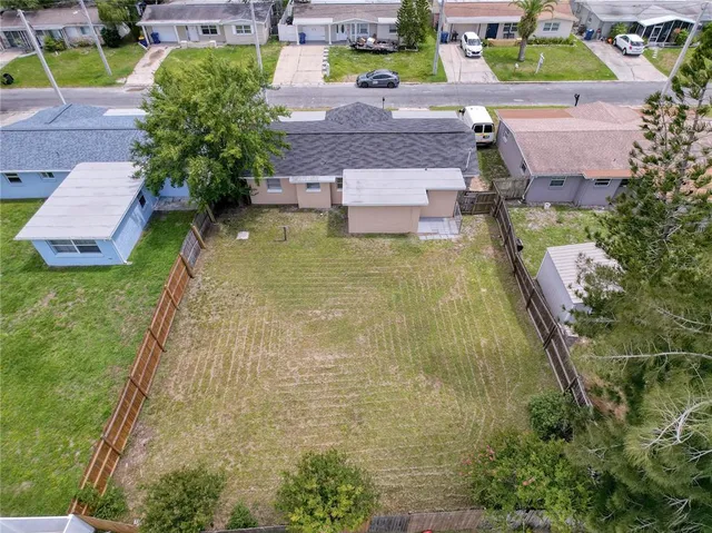a view of a swimming pool with a yard