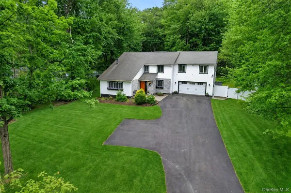 a front view of a house with yard