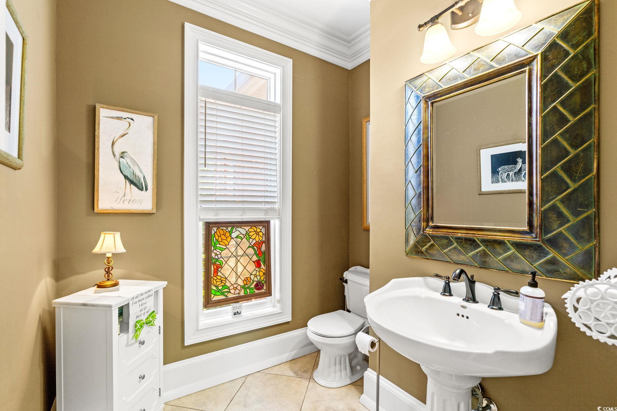 1119 Links Road Myrtle Beach, SC 29575 - Photo 27 of 40 Half bathroom featuring baseboards, toilet, crown