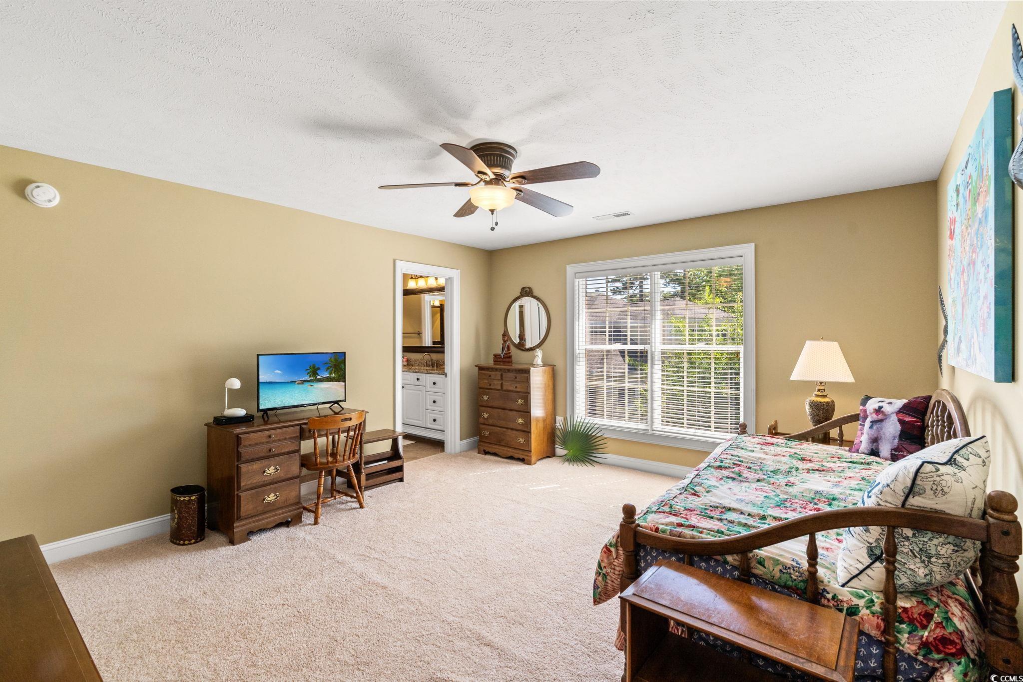 1119 Links Road Myrtle Beach, SC 29575 - Photo 35 of 40 Bedroom with carpet, baseboards, and a ceiling fan
