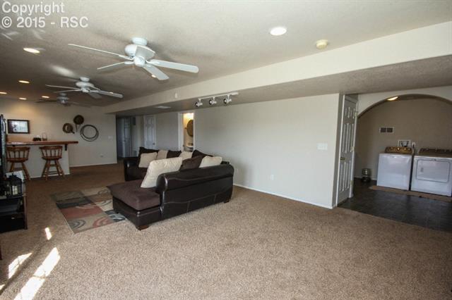 12475 Snaffle Bit Road Peyton, CO 80831 - Photo 26 of 35 Family Room