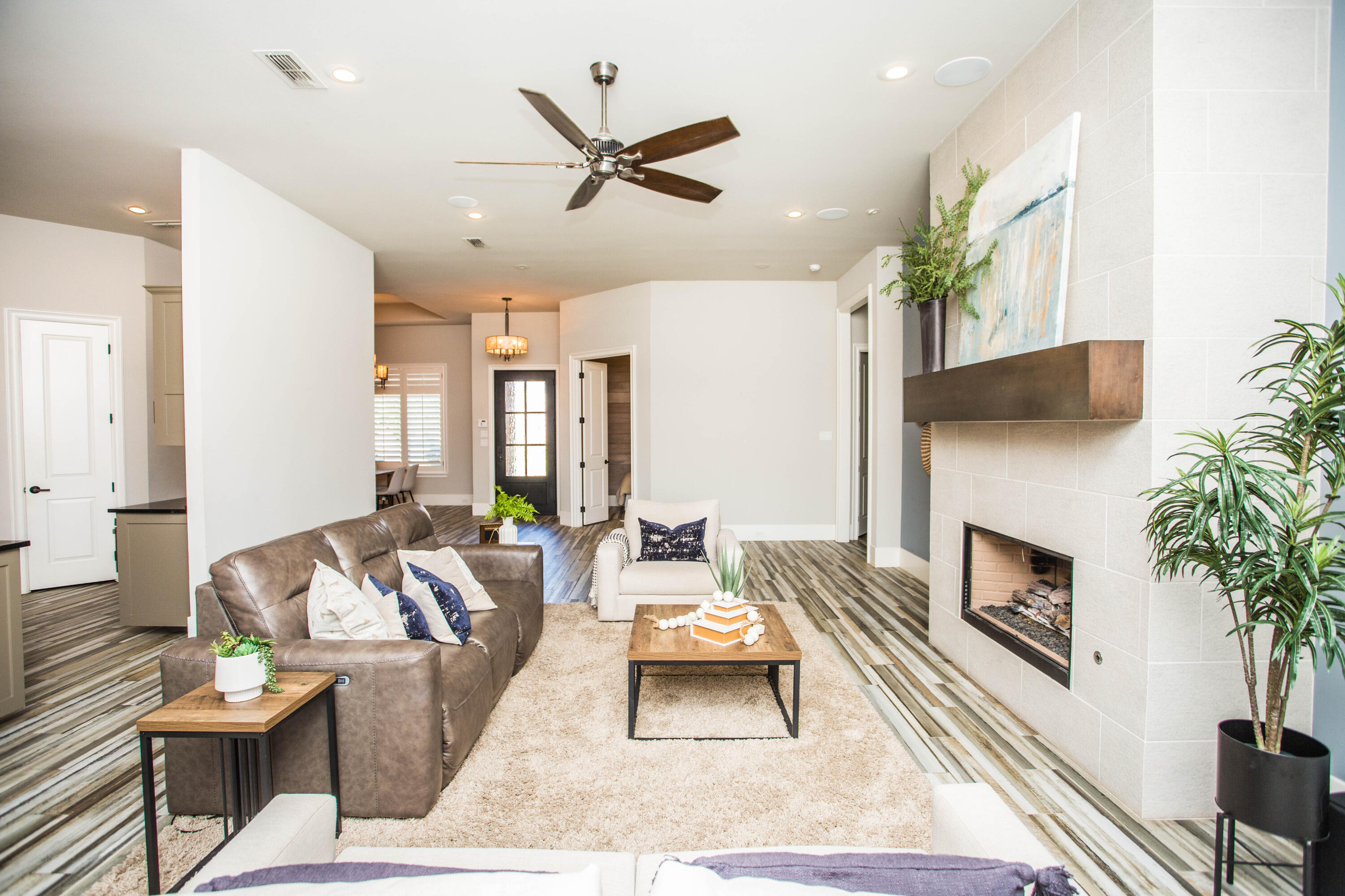 4807 116th Street Lubbock, TX 79424 - Photo 11 of 51 a living room with furniture fireplace and potted plant