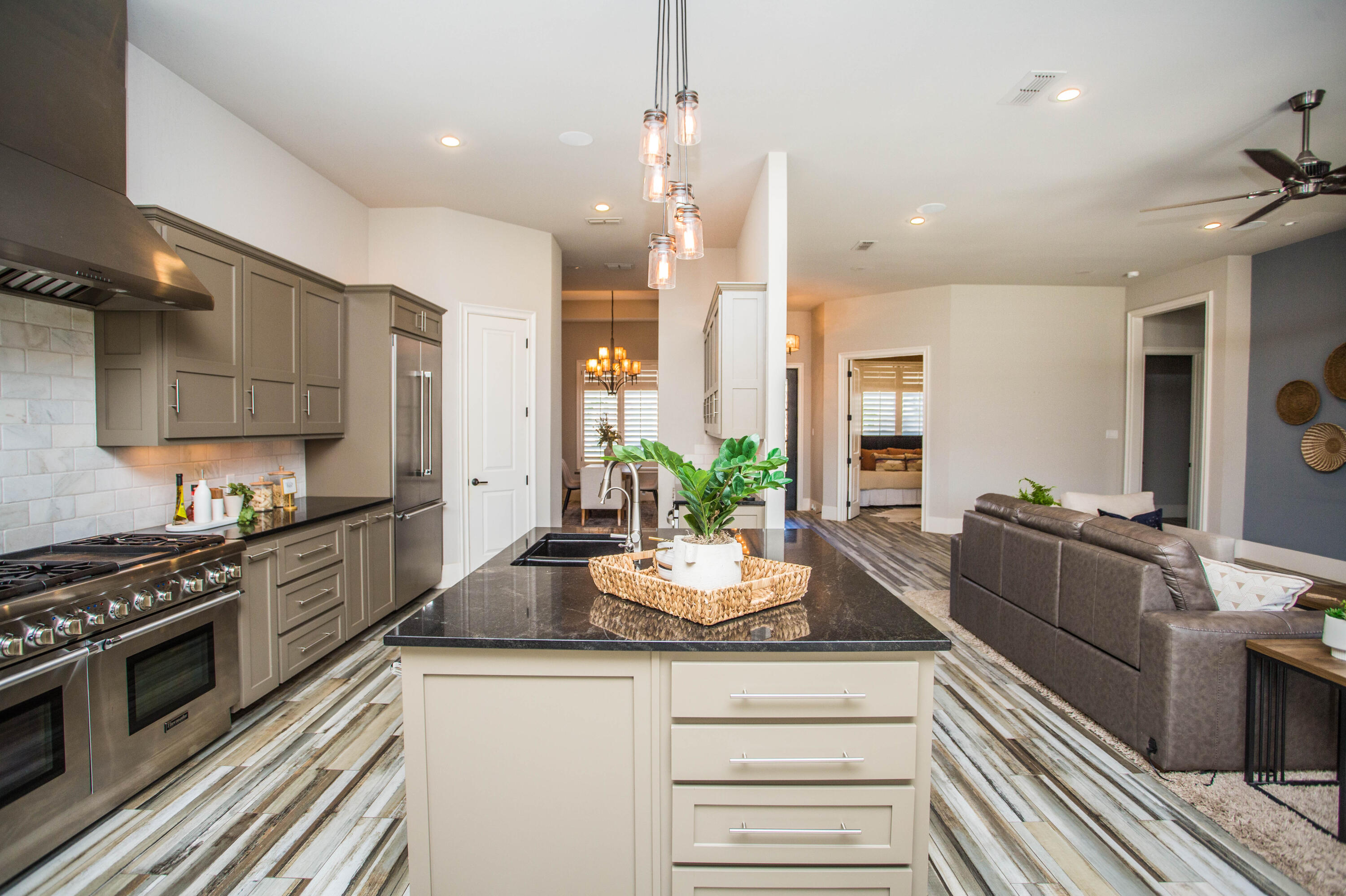 4807 116th Street Lubbock, TX 79424 - Photo 12 of 51 a kitchen with kitchen island granite countertop a large counter top space appliances and cabinets