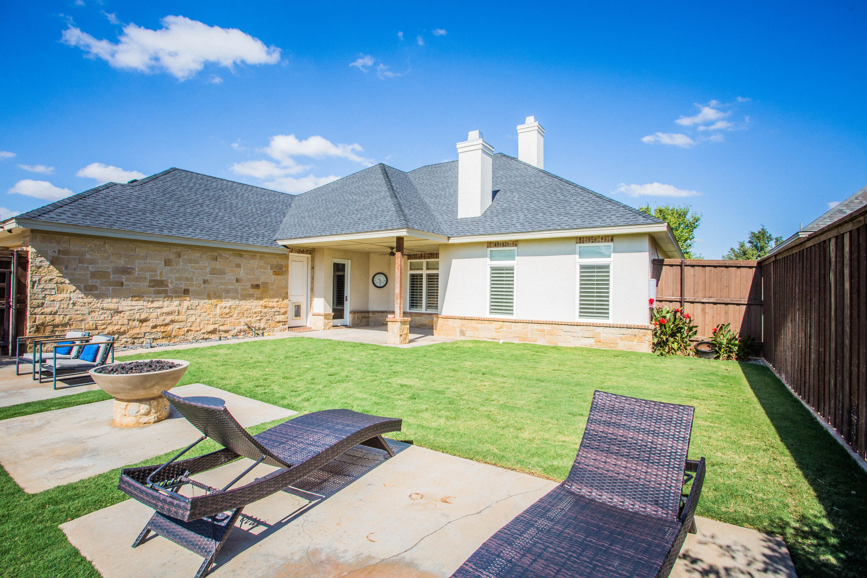 4807 116th Street Lubbock, TX 79424 - Photo 45 of 51 a view of a backyard with table and chairs with a yard