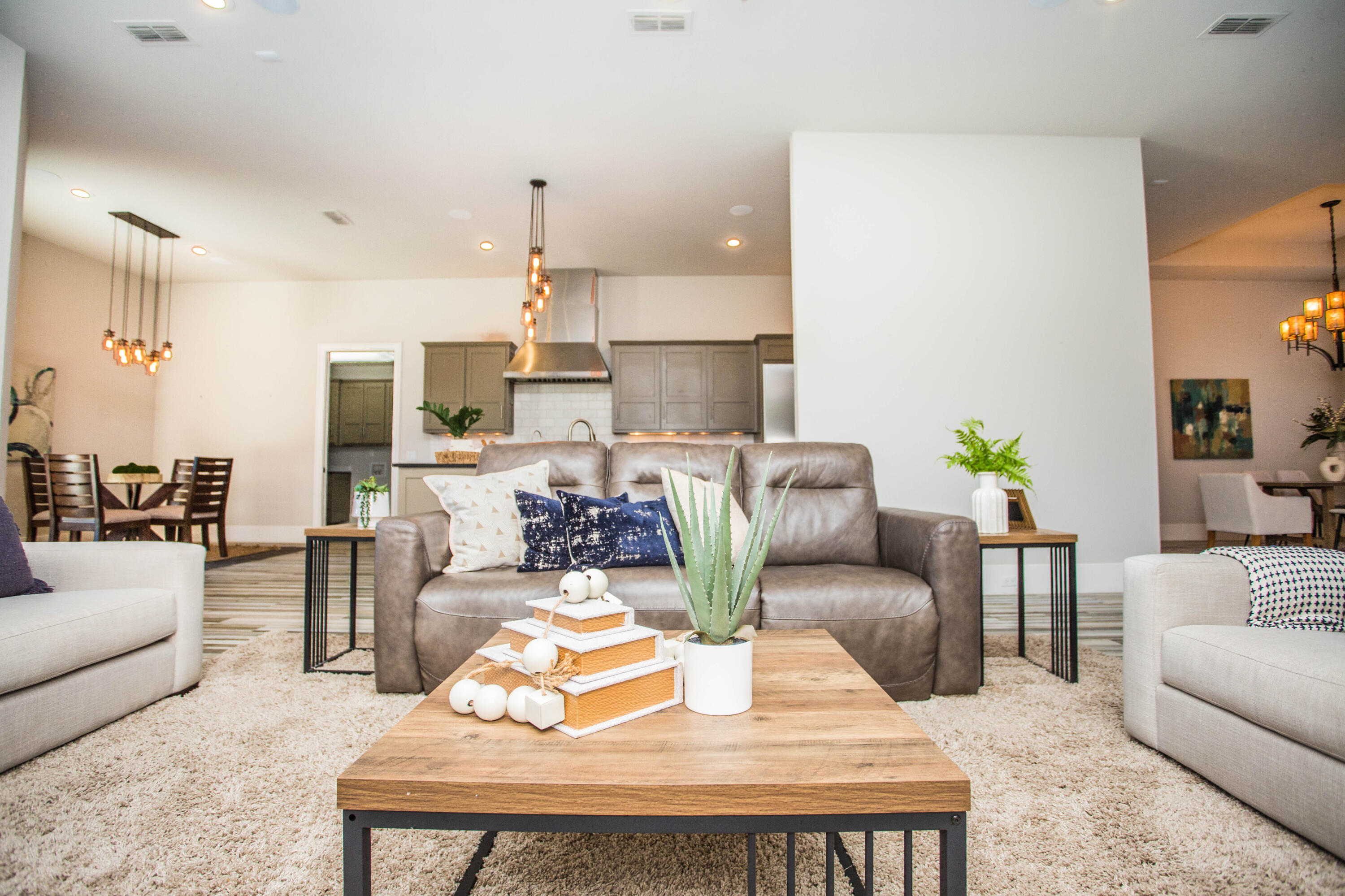4807 116th Street Lubbock, TX 79424 - Photo 10 of 51 a living room with furniture and a chandelier