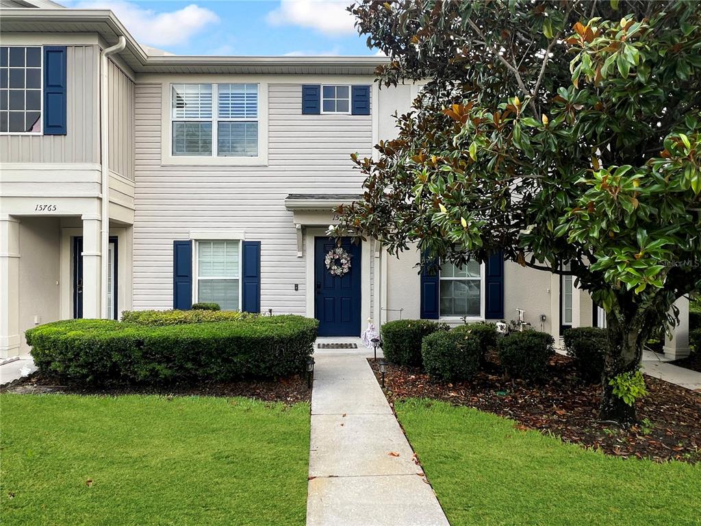 15767 Stable Run Drive Spring Hill, FL 34610 - Photo 2 of 34 a front view of a house with garden