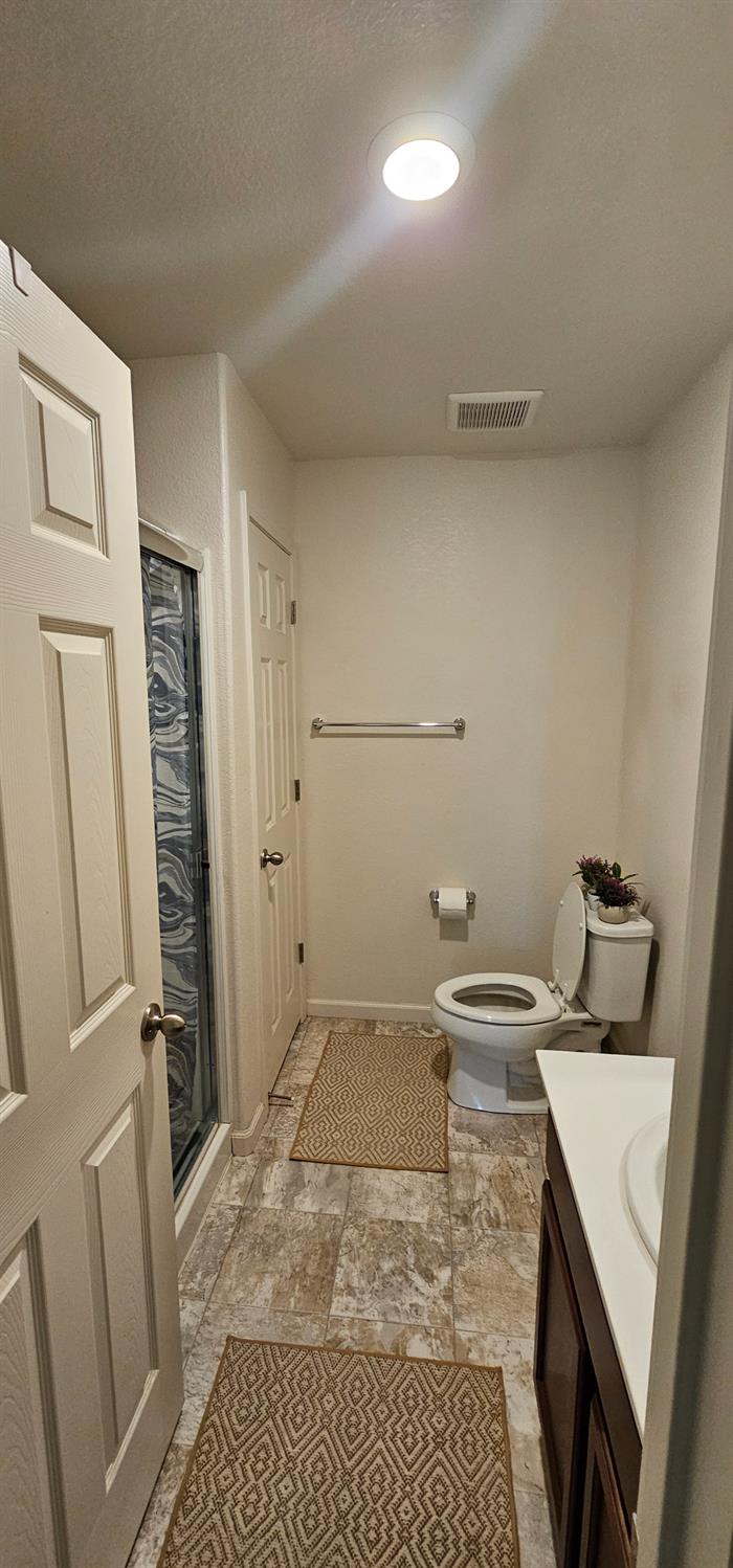 9290 Brock Court Live Oak, CA 95953 - Photo 12 of 29 a bathroom with a sink and a washing machine