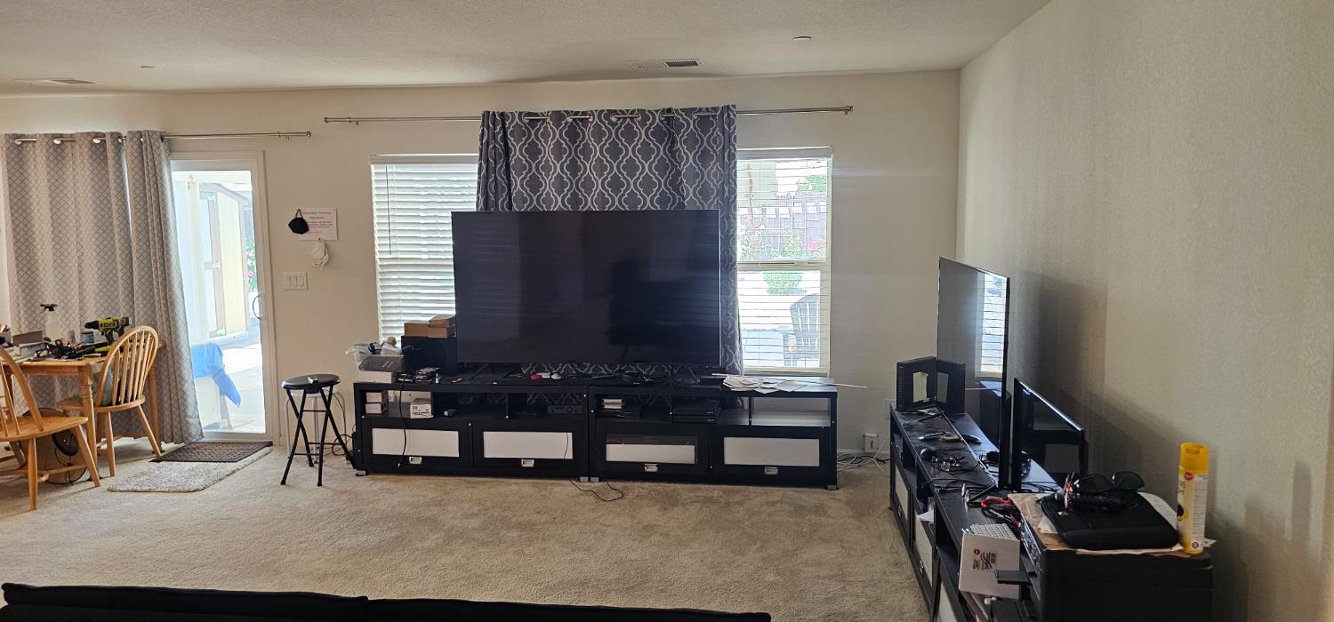 9290 Brock Court Live Oak, CA 95953 - Photo 9 of 29 a living room with furniture and a flat screen tv