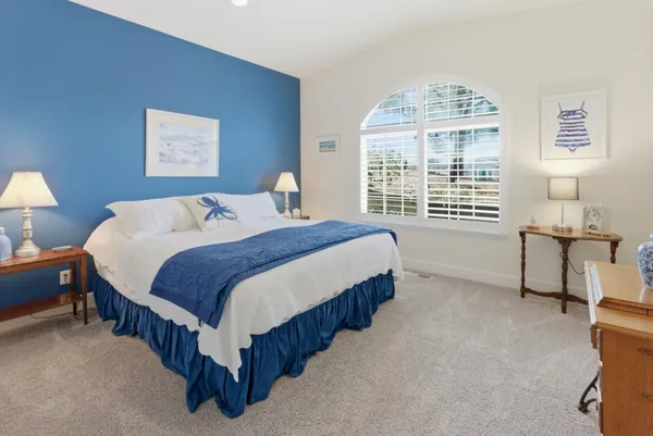 a bed room with a bed and a television