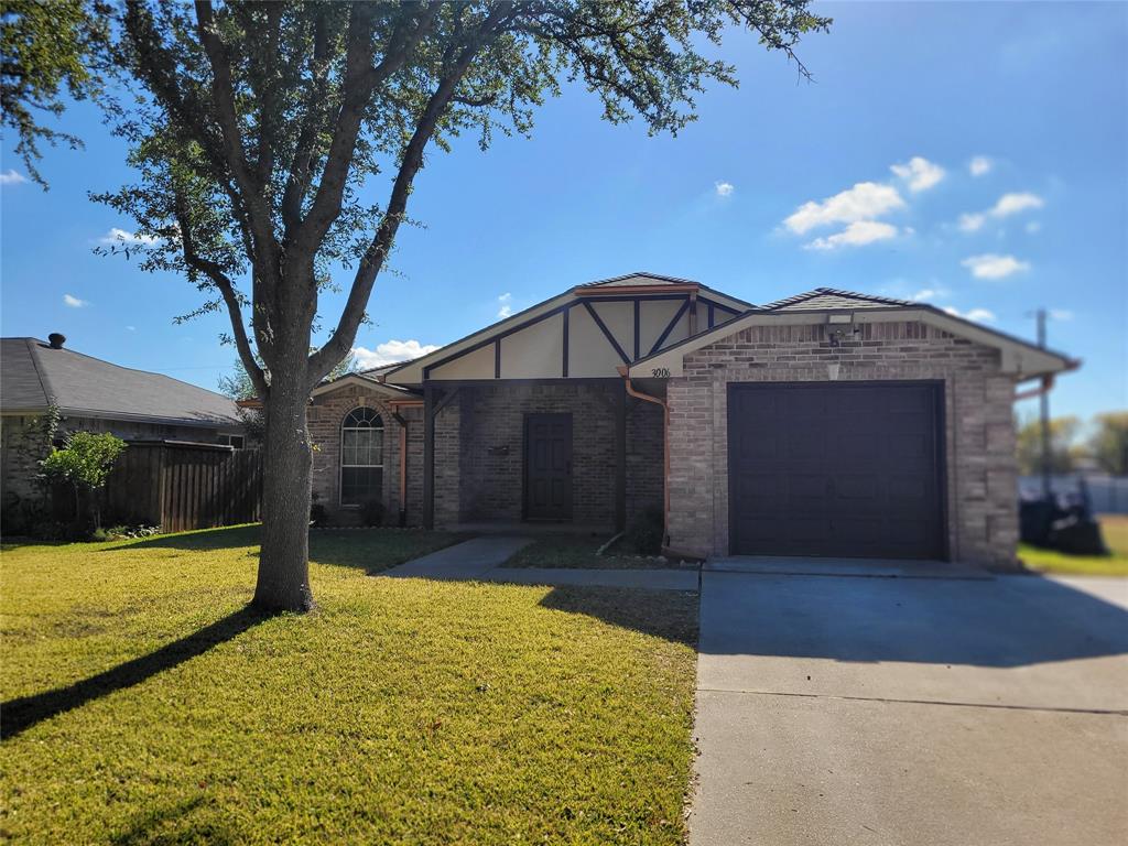 3006 Ruidosa Avenue Dallas, TX 75228 - Photo 2 of 9 a front view of a house with a yard