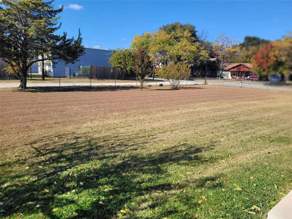 3006 Ruidosa Avenue Dallas, TX 75228 - Photo 5 of 9 a view of road with large trees