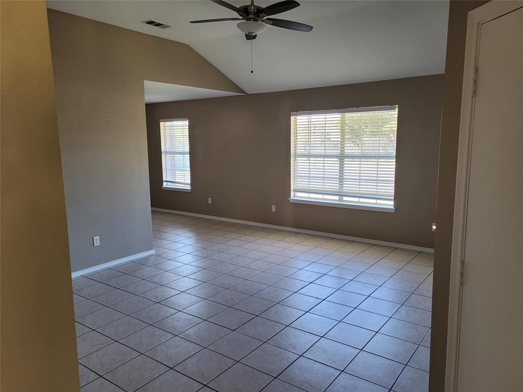 3006 Ruidosa Avenue Dallas, TX 75228 - Photo 7 of 9 a view of an empty room with a window