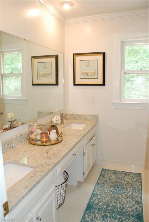5105 Tower Road Greensboro, NC 27410 - Photo 21 of 25 Hall bath with new counter tops & dual vanity