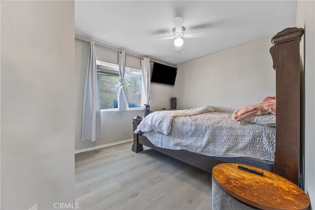 a bedroom with a bed and window