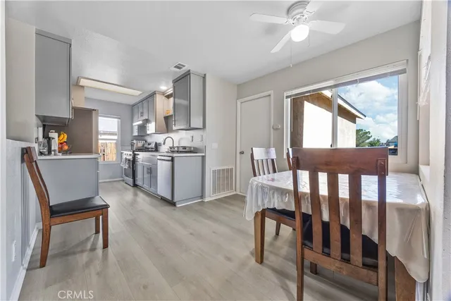 a living room with stainless steel appliances kitchen island granite countertop furniture and a kitchen view