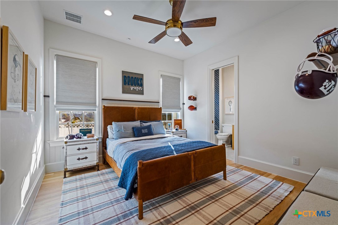 1755 Riada Drive New Braunfels, TX 78132 - Photo 19 of 48 a bedroom with a bed and a window