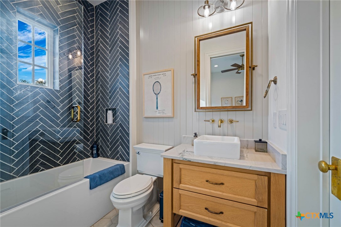 1755 Riada Drive New Braunfels, TX 78132 - Photo 20 of 48 a bathroom with a sink a toilet and a mirror